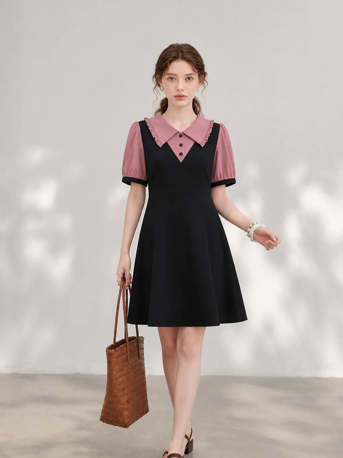 AI clothing photo of a black dress with a dusty pink collar and puff sleeves