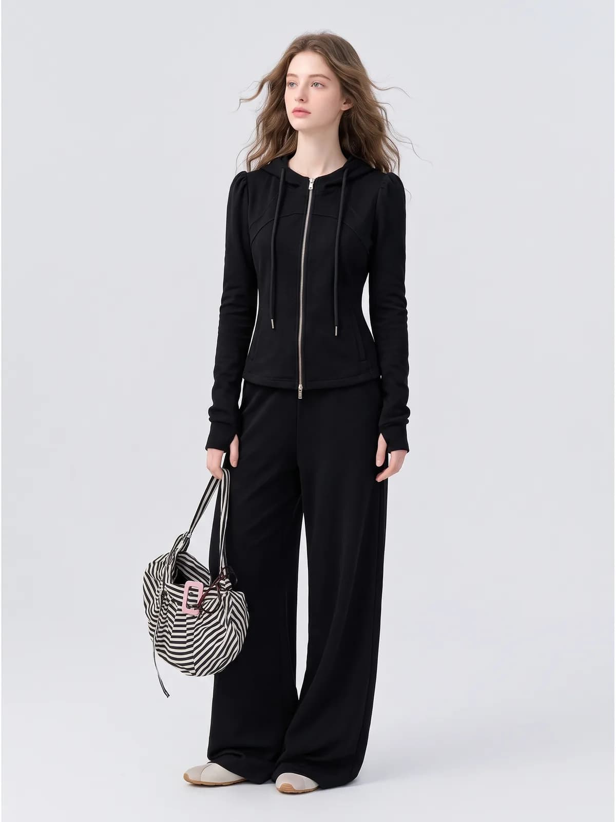 AI clothing photo of a black zip hoodie and wide-leg trouser set