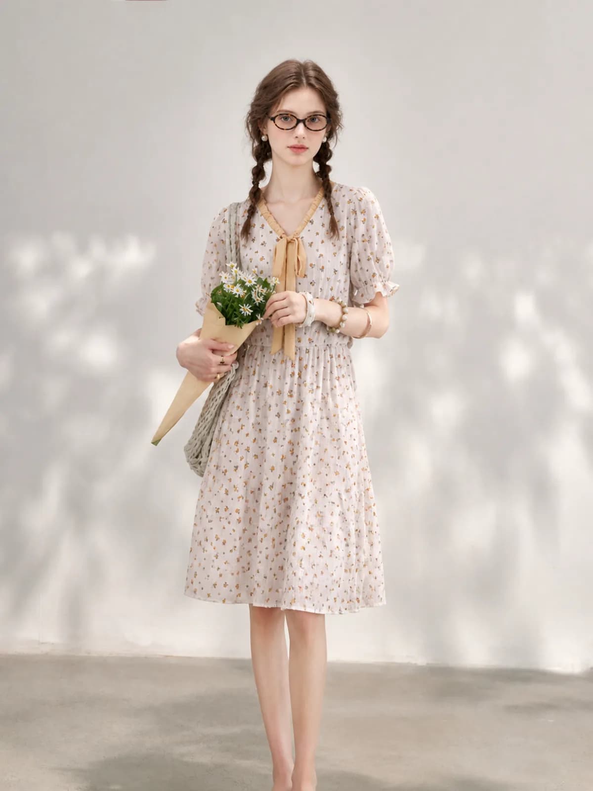 AI clothing photo of an ivory ditsy floral dress with a mustard tie