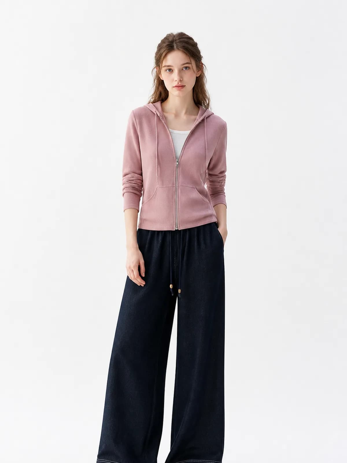 AI clothing photo of a dusty pink zip hoodie and indigo wide-leg trousers