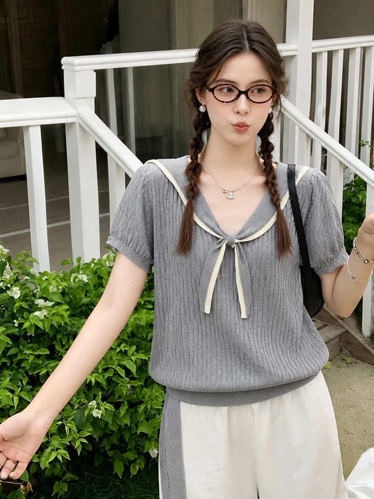 AI photoshoot frame of a grey knit sailor-collar top on a porch