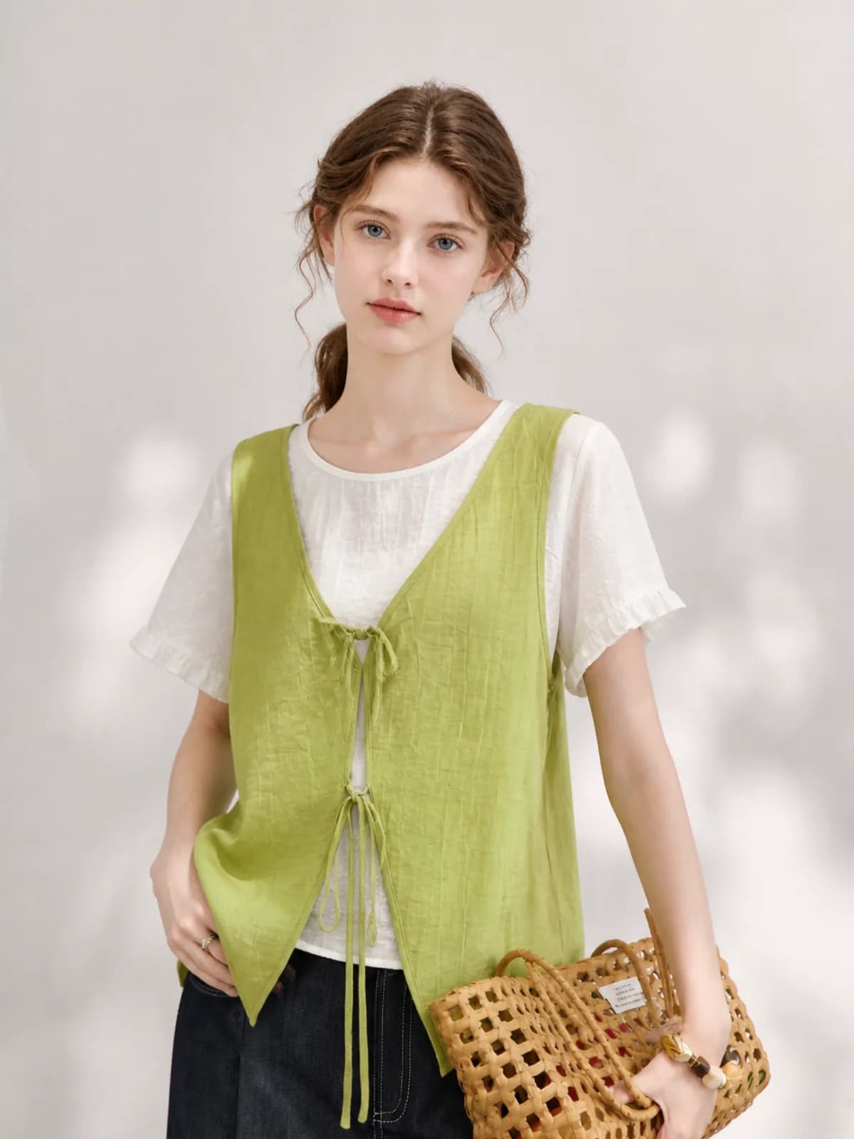 The same green tie-front vest after an AI model swap to a European model