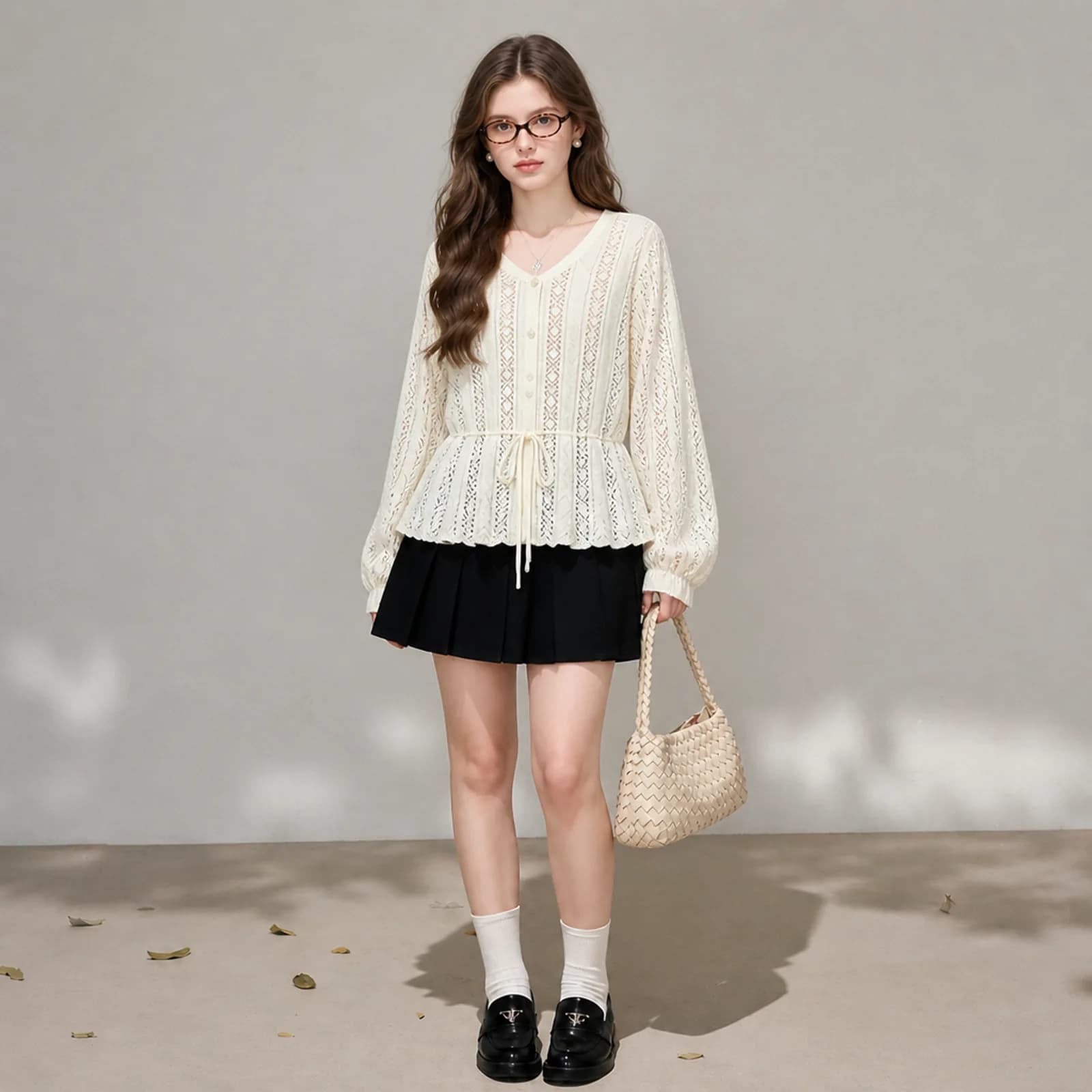AI model wearing an openwork pointelle knit top with a drawstring peplum and scalloped hem