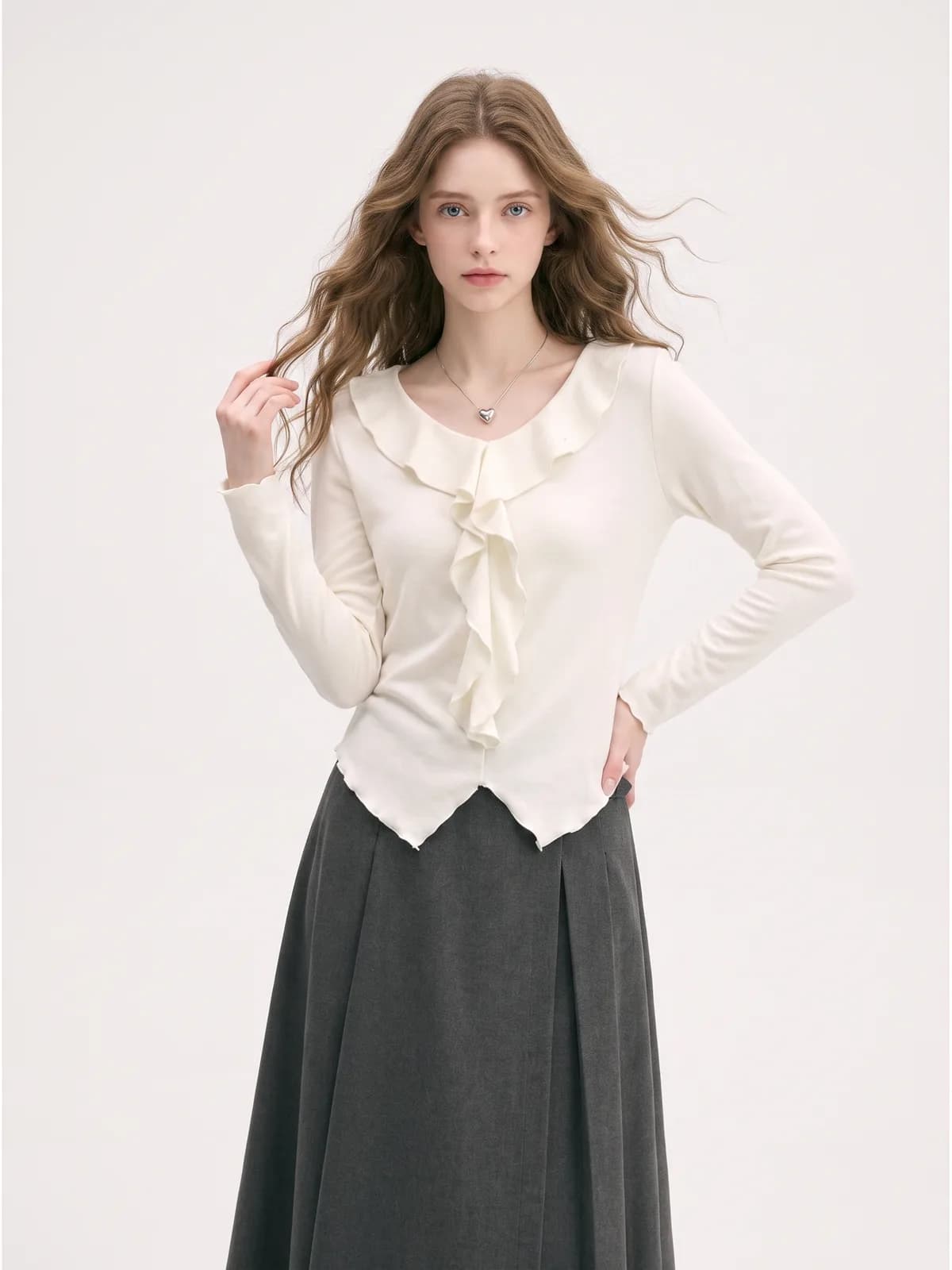 Cream ruffle-placket top and charcoal maxi skirt on an AI model, front-facing