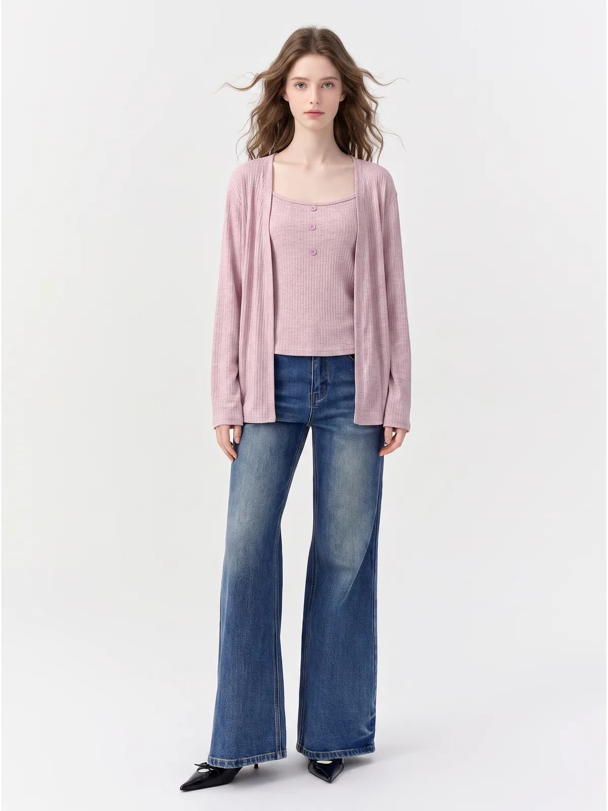 AI model wearing a pink ribbed cardigan over a matching cami with wide-leg jeans, front view