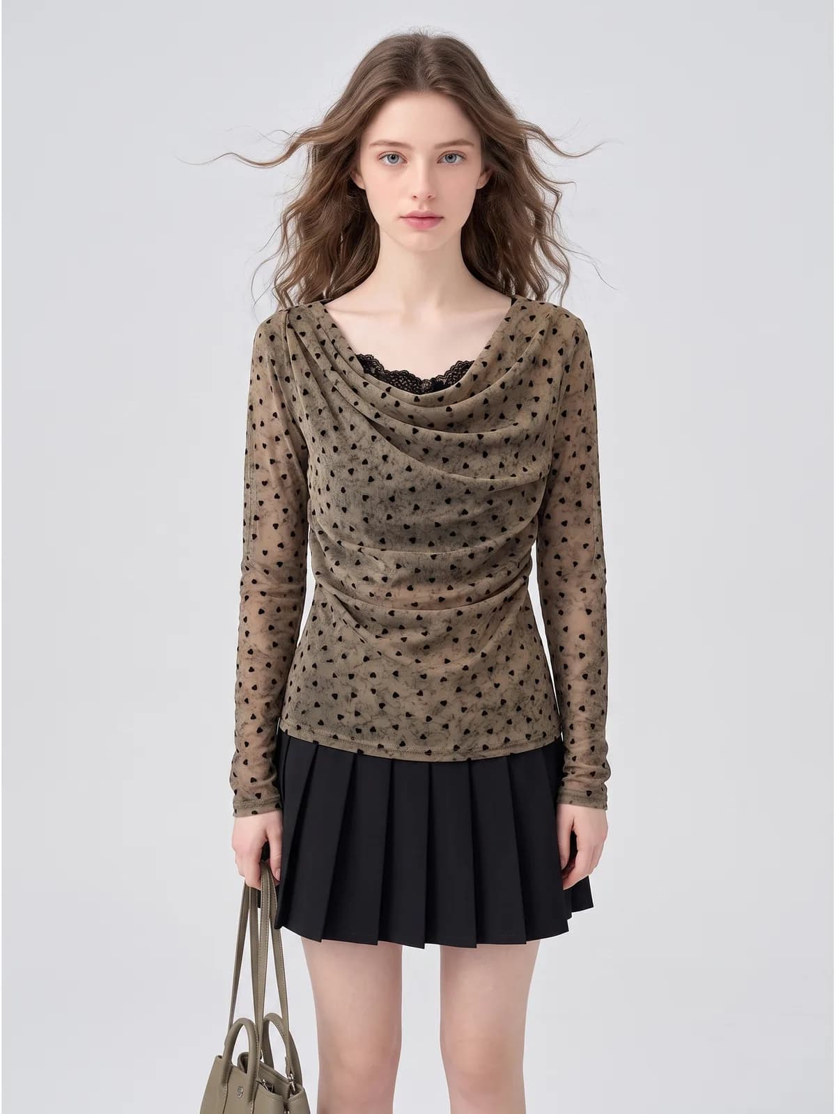 AI model wearing a sheer flocked-heart mesh cowl-neck top over a black lace cami