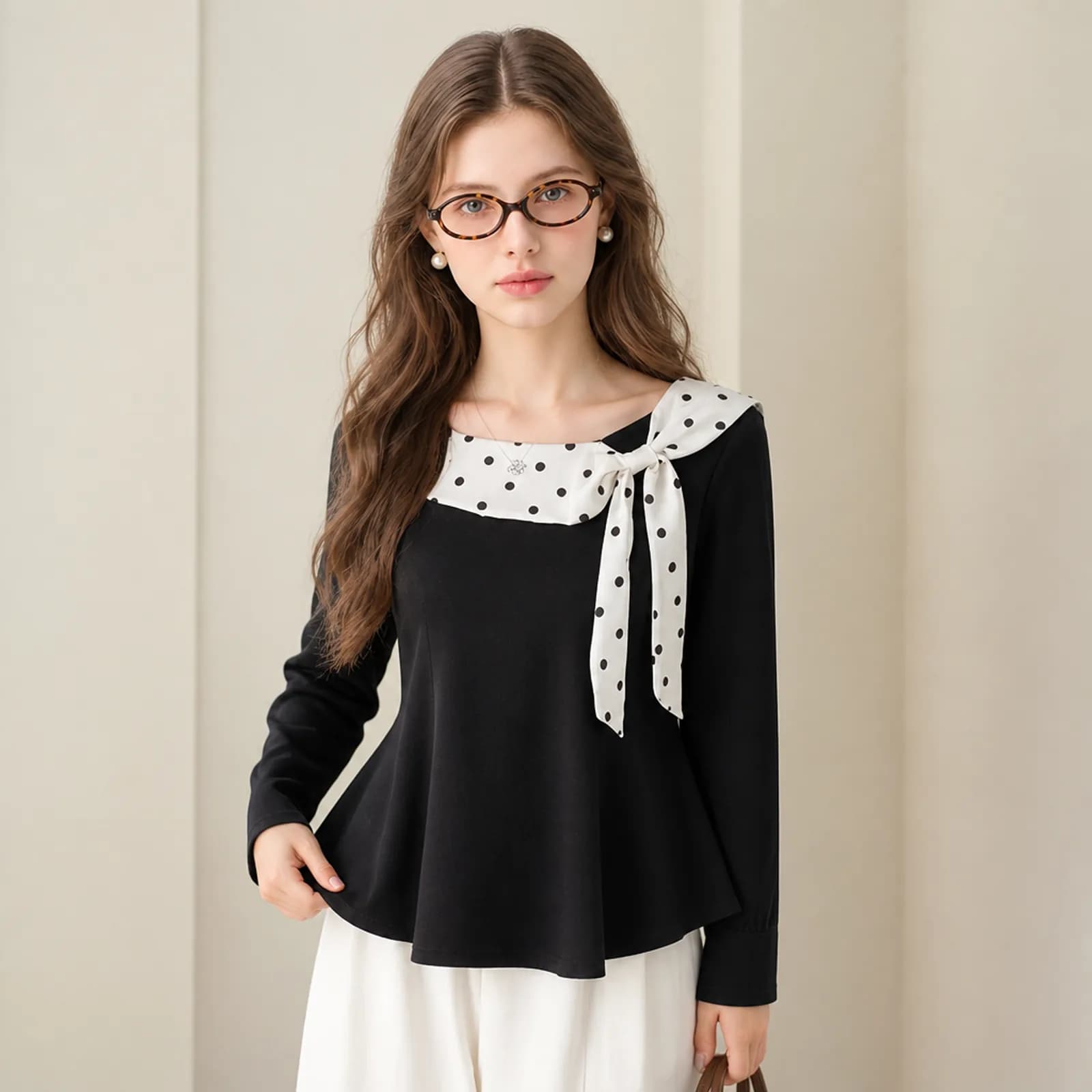 Black peplum top with a polka-dot bow on an AI model, Amazon listing gallery image