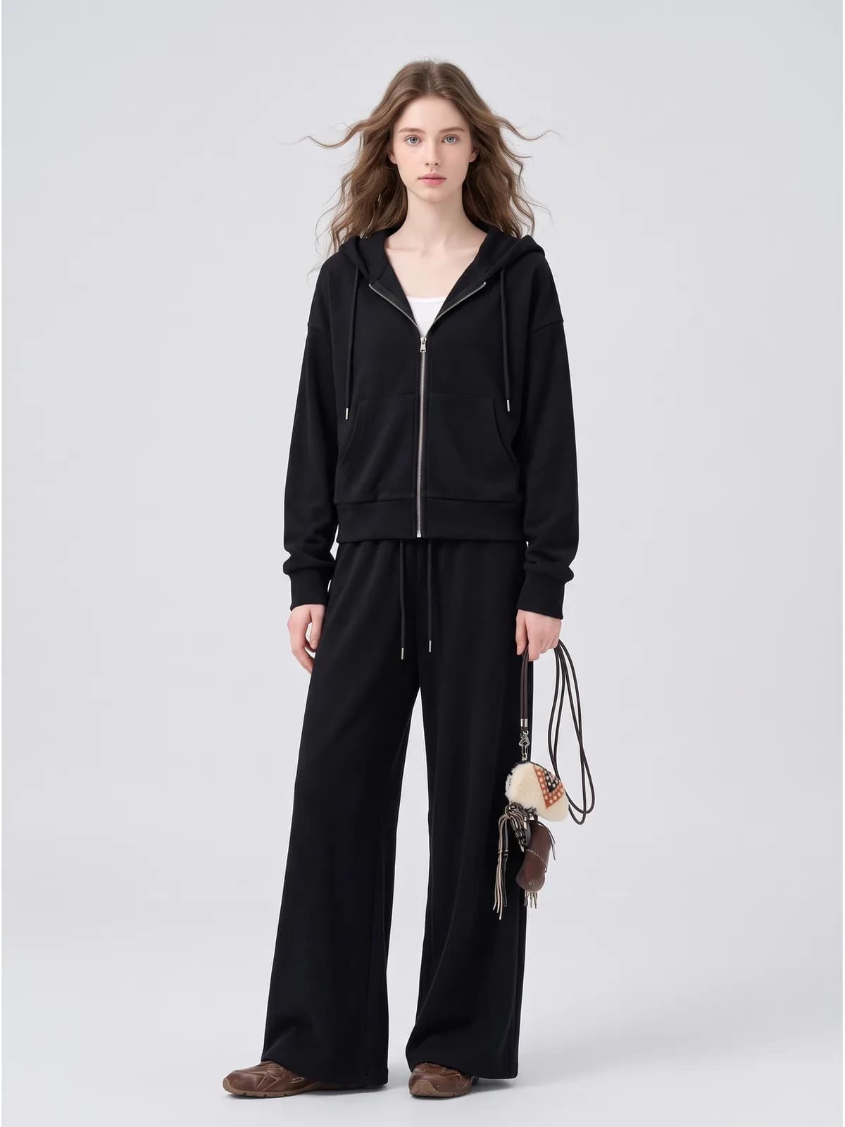 Black zip hoodie and wide-leg jogger set on an AI model, Amazon gallery image