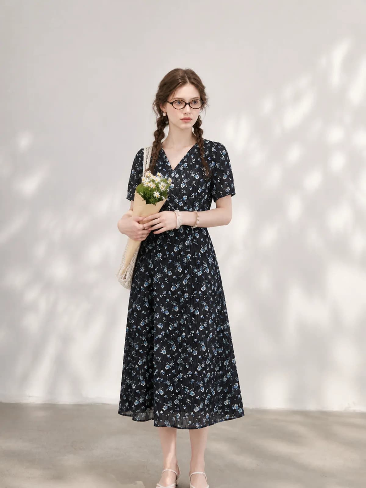 Navy blue floral wrap dress on an AI model for an Etsy clothing listing