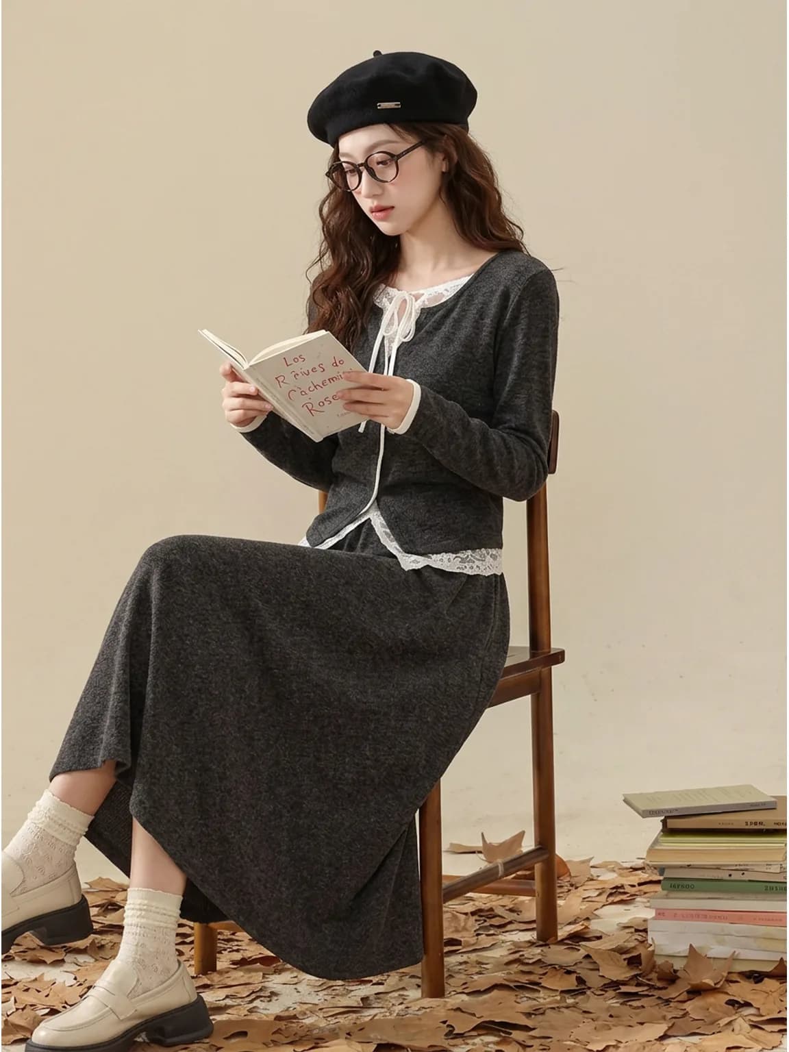 The same black wool beret worn in a seated autumn frame