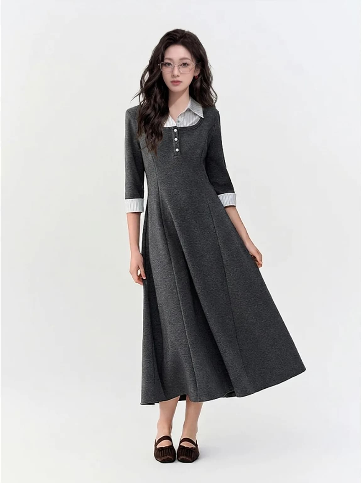 The same metal-rim glasses worn with a charcoal knit dress