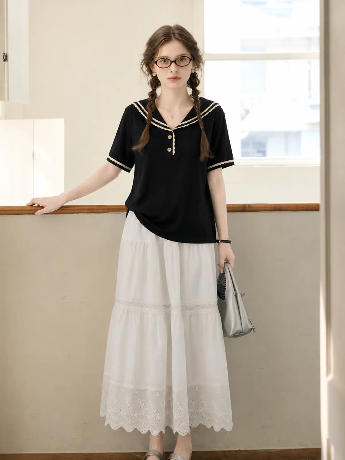 AI on-model photo of a black sailor-collar top for a resale listing
