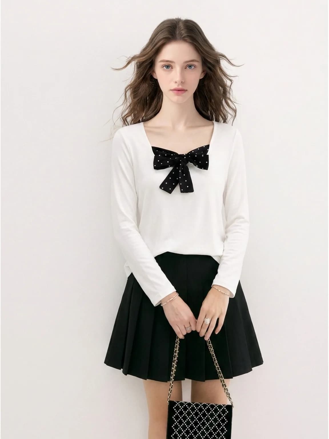 White top with a black polka-dot bow, AI product photo for a resale listing